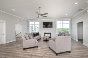 sitting area with couches and tv in the clubhouse in the Knob Hill community