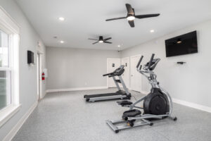 workout room with exercise equipment and TV