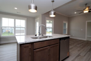 Kitchen island with sink in the Maria floor plan| Homes in Southern Indiana