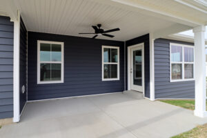 Rear view of the back porch with ceiling fan in the Maria floor plan Homes in Southern Indiana